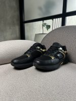 Tenis Giuseppe Zanotti negras con detalles dorados