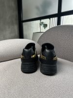 Tenis Giuseppe Zanotti negras con detalles dorados - Image 5